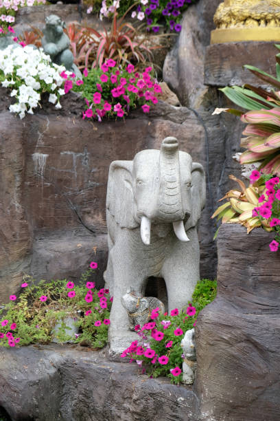 istock stone sculpture of an elephant with white tusks 2167279976