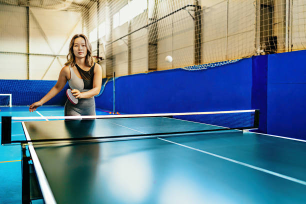 istock Woman playing ping pong in gym 2167281895