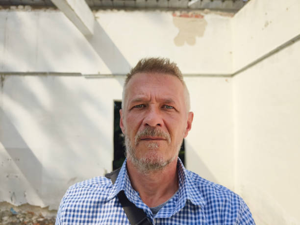Portrait of a despair man inside of ruined business building