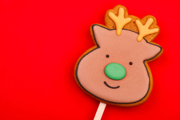 istock Reindeer gingerbread cookie on red background 2167282589