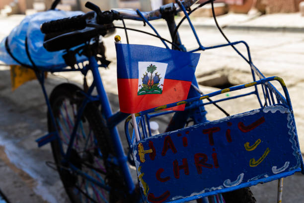 A bicycle with a Haitian flag in Haiti's second largest city. Sunday, August 11, 2024, Cap haïtien, Haiti.