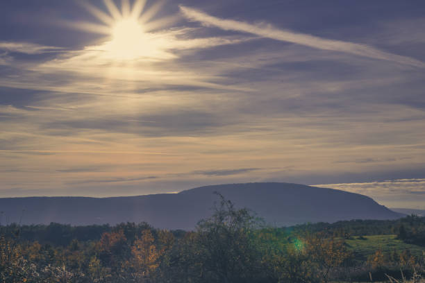 sun in the blue sky falling down