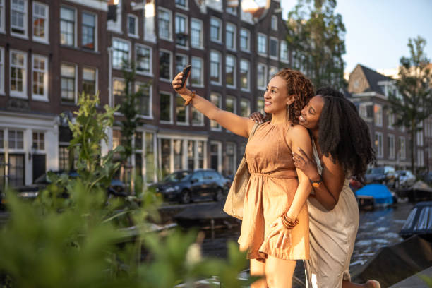 istock Two black female friends getting close on a Amsterdam sightseeing trip 2167286967