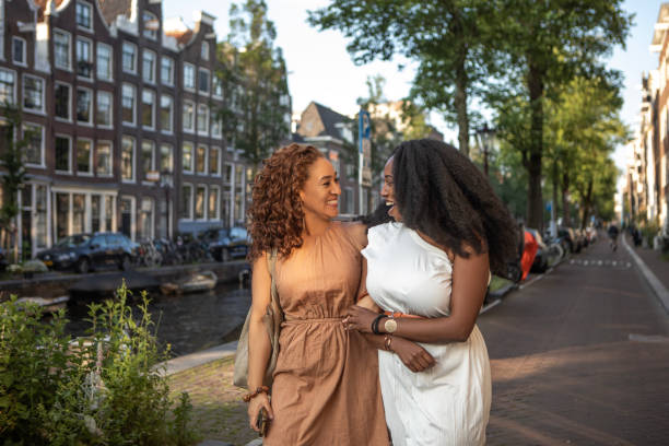 istock Two black female friends getting close on a Amsterdam sightseeing trip 2167286983