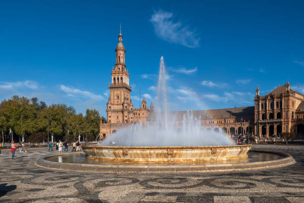 Seville, Andalusia, Spain - October 24, 2023: Fountain and pavilion at Plaza de Espana city square in Maria Luisa Park, built for the Ibero-American Exposition of 1929.