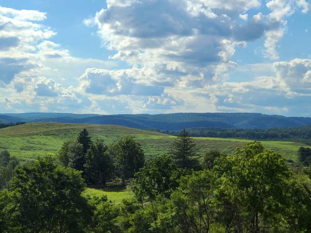 istock Forested Hills with Barn and Pastures on a Hill in the Distance 2167294808