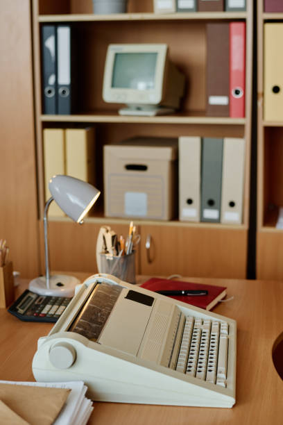 istock Organizing Office Supplies on Wooden Desk 2167295145