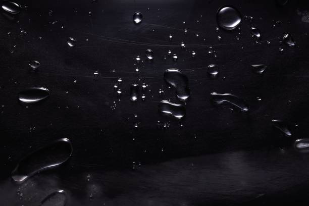Free Stock Photo of Water droplets on a dark surface creating shapes ...