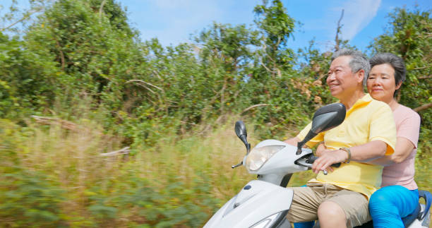 istock elder couple ride motorcycle happy 2167297932