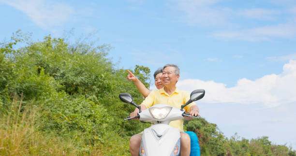 istock elder couple ride motorcycle happy 2167297945