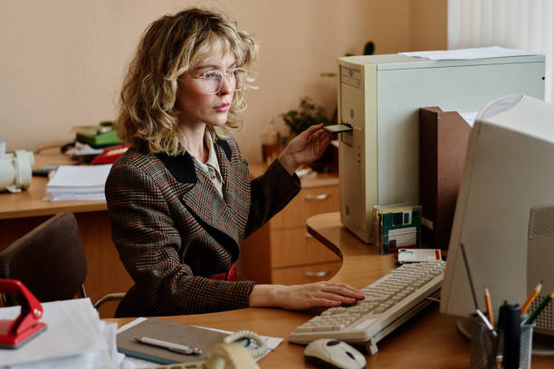 istock Portrait of Woman Using Computer at Office Desk Working 2167298202