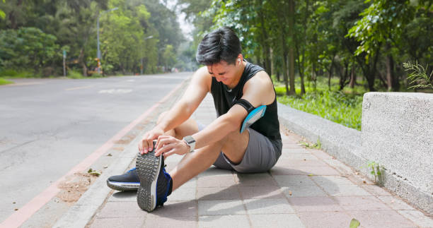 istock asian man sporting calf cramping 2167298617