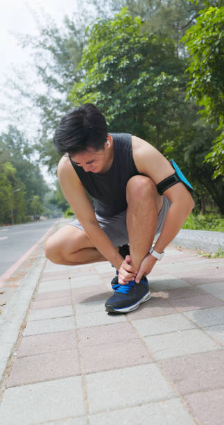 istock asian man sporting ankle injury 2167298812
