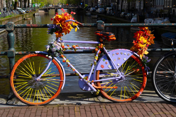 istock Old bicycle next to canal of Amsterdam 2167300178