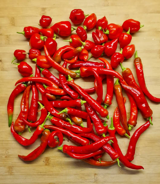 istock Red Peppers on Wooden Background 2167303576
