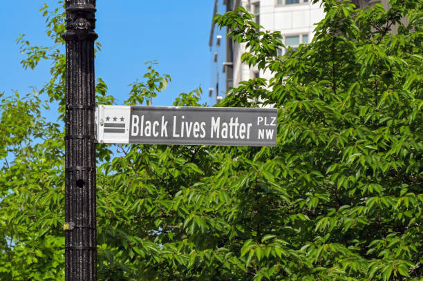 Washington DC, District of Columbia, USA - 30 April 2024: Sign with Black Lives Matter text on a pole in a street in central Washington DC