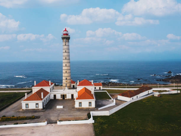 View of lighthouse, typical Portuguese architecture, with nice details and very particular framing, blue sky as background, located in Leça da Palmeira, Porto, Portugal. Matosinhos stock photo