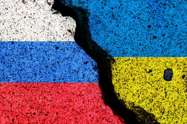 istock Russian and Ukrainian flags with a crack between them 2167304180