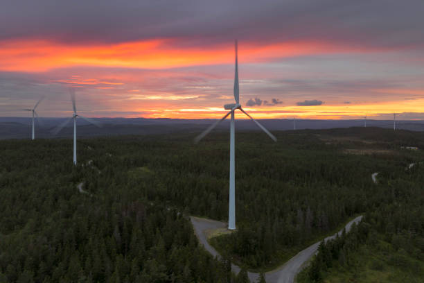Land based wind turbines in a forest landscape on a beautiful evening at sunset in Dalarna, Sweden.