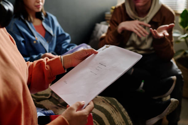 istock Reviewing Document During Informal Team Meeting 2167307337
