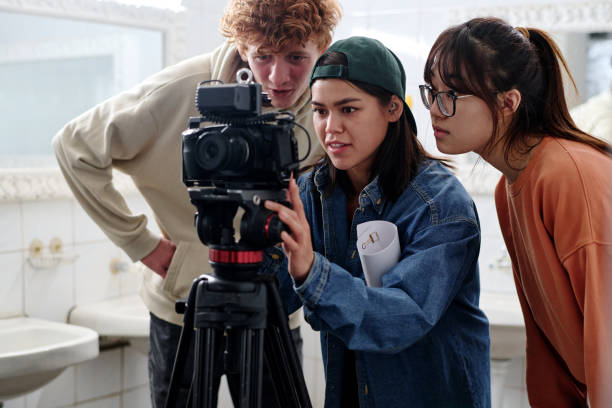 istock Filming Scene with Focused Team Members and Camera 2167307389