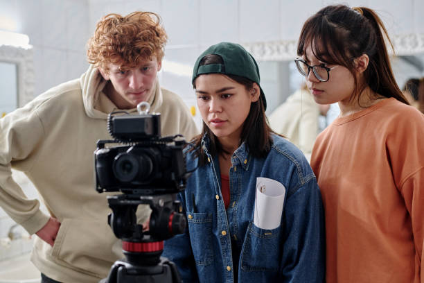 istock Filming Group of Young Adults Collaborating on Creative Project 2167307398