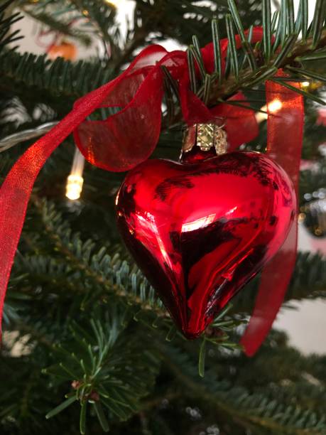 istock A shiny red heart hangs on the Christmas tree 2167307711