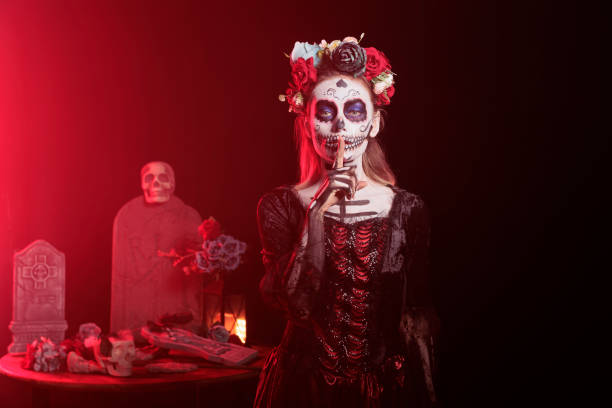 istock Lady doing quiet hand gesturing during Mexican holiday of remembrance 2167312657