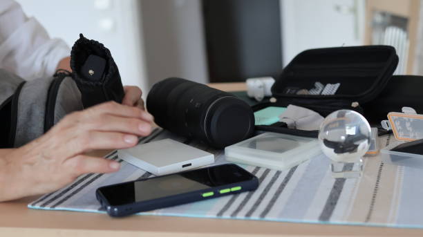 Close-up of hand and photographic equipment