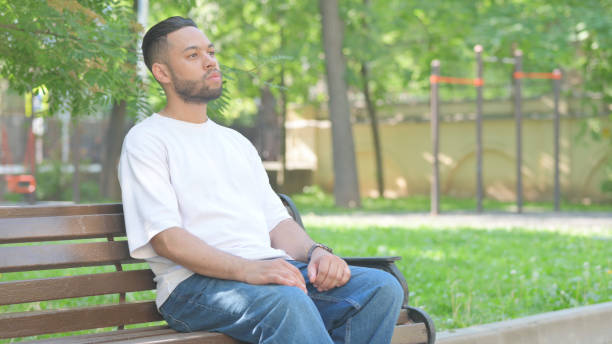 istock Pensive Outdoor Sitting Middle Aged Man Brainstorming an Idea 2167318659