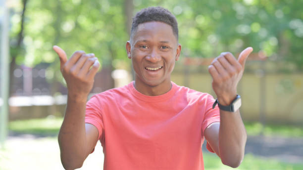 istock Inviting Gesture by Casual African Man Standing Outdoor 2167319883