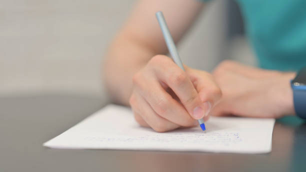 istock Close up of Man Writing a Letter 2167320064