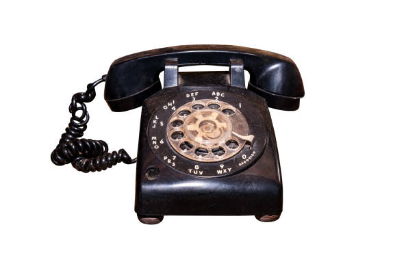 The old dial phone is dirty and scratched isolated on white work with clipping path