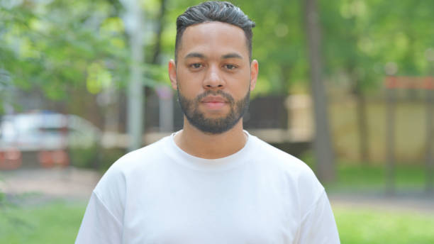 istock Serious Young Man Outdoor in Park 2167321780