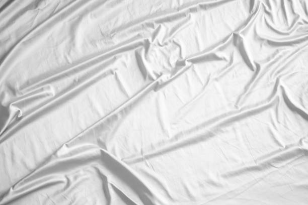 istock Abstract white wrinkled bedding sheet fabric texture background 2167322263