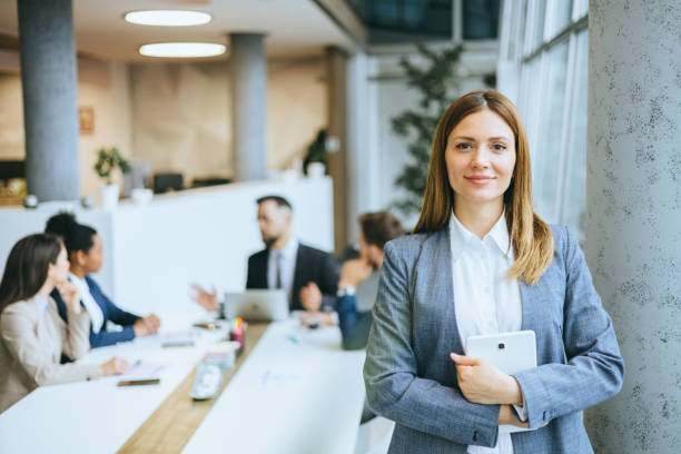 Smiling businesswoman with digital tablet
