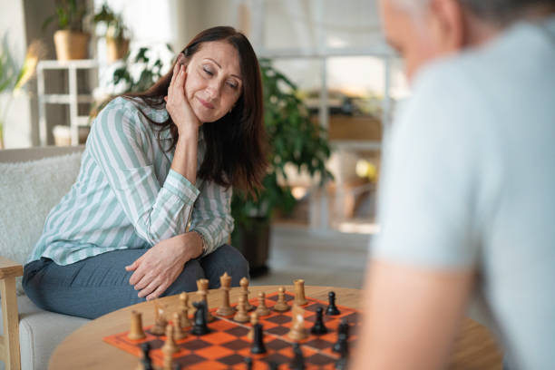 istock Hobbies over 50. Friends Playing Chess. Game Night. 2167323159