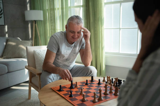 istock Strategy Games for Over 50. Friends Playing Chess. 2167323167