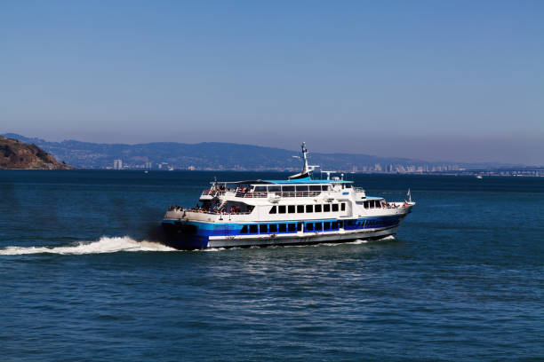 Marin, California, United States - August 1, 2011: Blue And White Ferry Boat On San Francisco Bay With Passengers And Black Exhaust