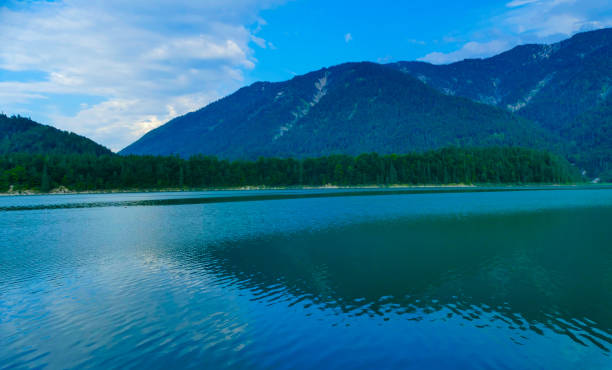 istock Lake Sylvensteinsee in evening with mountain reflection 2167325415