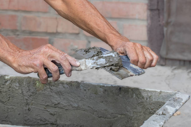 istock Hand metal spatula for plastering.Man cementing a path in the yard.Construction tools. 2167328962