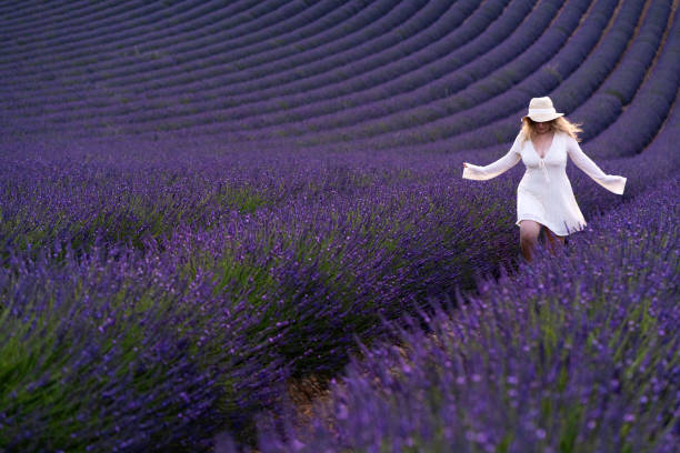 istock Woman skipping in lavender fields, Provence 2167332185
