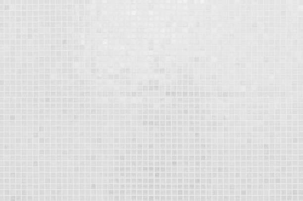 istock White tile wall chequered background bathroom texture. Ceramic brick wall and floor tiles mosaic background in bathroom and kitchen clean. Design pattern geometric with grid wallpaper decoration. 2167336533