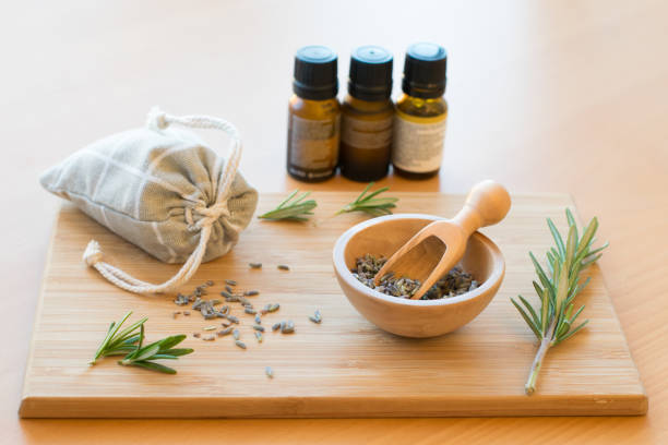 Lavender Potpourri, Herbs and Essential Oil on the Wooden Board
