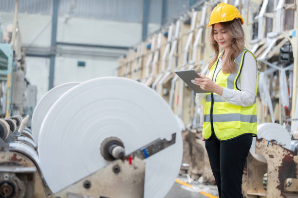 istock By redesigning outdated machinery, a European female engineer changed industry practices, demonstrating her outstanding skills and progressive approach. Around her, plastics were being produced. 2167340182