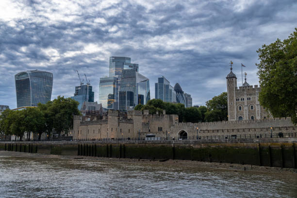 London, England, UK - July 24, 2024: This image shows a cityscape view of London at dusk, from the River Thames.