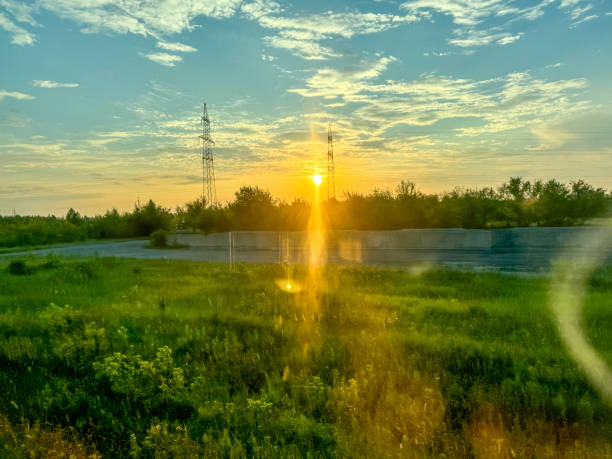Electric poles at sunset in summer.