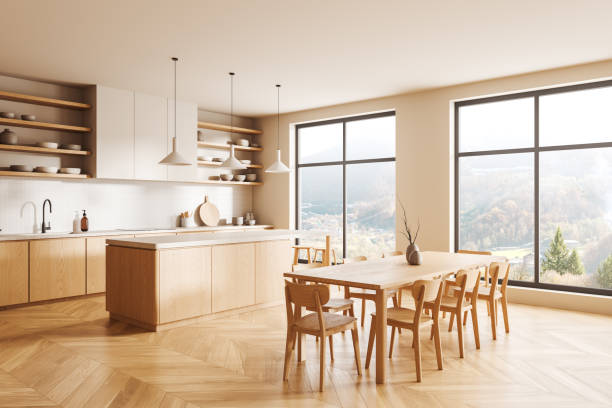 istock Stylish home kitchen interior with eating table, bar island and panoramic window 2167346973
