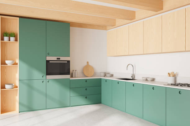 istock Green home kitchen interior with cooking cabinet, shelves with kitchenware 2167348183
