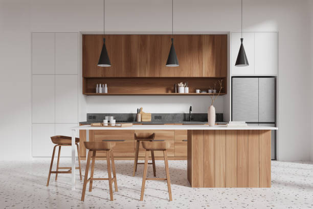 istock Image showing a modern kitchen interior with wooden cabinets and stools, light background, 3D rendering. Concept of contemporary home design 2167348649